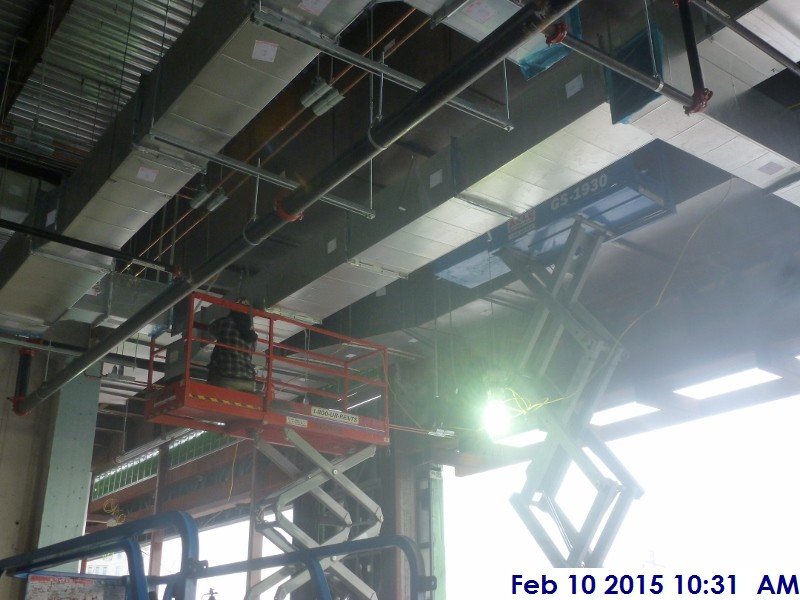Installing Black iron duct work at the 4th floor Facing East